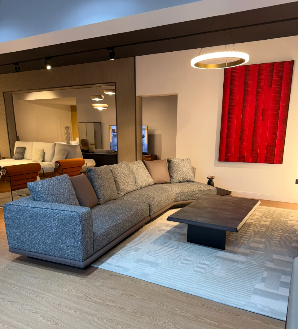 Modern luxury living room furniture showroom with contemporary sofa and coffee table by Lunavix Interiors