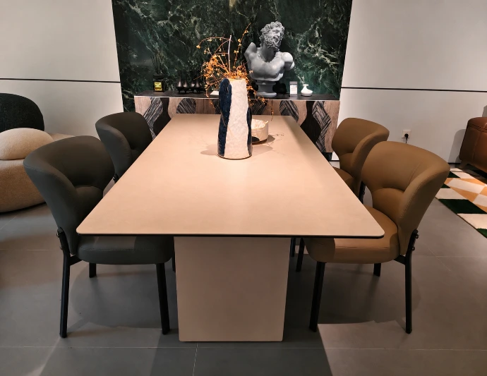 Modern dining table set with sculptural decor and contemporary chairs